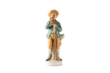 Vintage porcelain period figure of a man smoking a pipe with a rifle isolated on white background