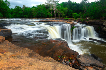 Beautiful waterfall, violent stream in the deep forest.Tropical waterfall Tadtone in climate forest, Chaiyaphum Province in Northeast thailand.