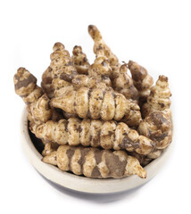 Fresh geoduck screw vegetables stacked in a traditional bowl ready for preparation in a cozy kitchen