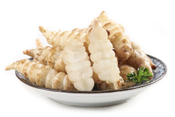 Fresh ground loop pagoda screw cabbage arranged on a plate with a garnish in a culinary setting