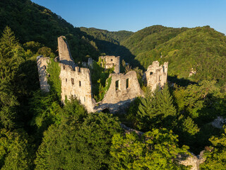 Obraz premium Aerial View of Ruins of an Old Fortress in the Forested Hills near Samobor, Croatia