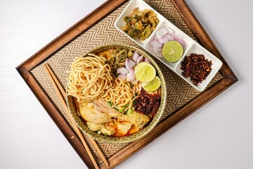 Northern thai curry Noodles with chicken on white background , Thai called  khao soi kai ,Northern food of thailand