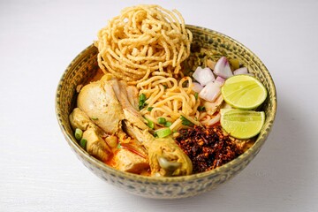 Northern thai curry Noodles with chicken on white background , Thai called  khao soi kai ,Northern food of thailand