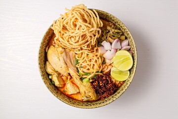 Northern thai curry Noodles with chicken on white background , Thai called  khao soi kai ,Northern food of thailand