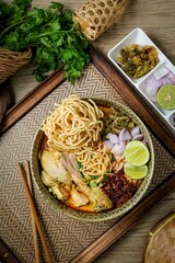 Northern thai curry Noodles with chicken on white background , Thai called  khao soi kai ,Northern food of thailand