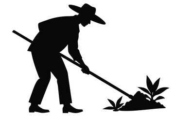 Silhouette of Farmer Tilling Soil with a LongHandled Tool Beside Young Plants