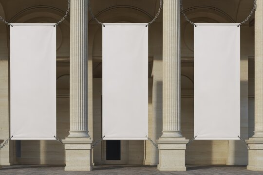three large vertical rectangular blank banners hanging between classical stone columns