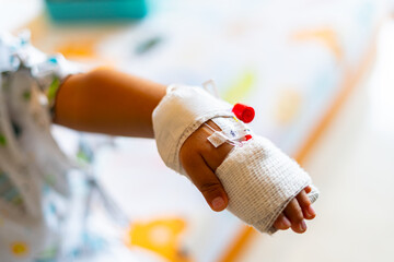 child's hand was punctured with an IV needle by a doctor.