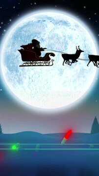 Coloured christmas string lights flashing over winter scene with santa passing full moon in sleigh