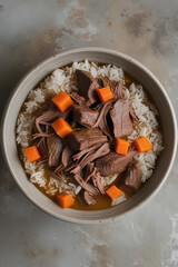 Comforting Beef Stew with Carrots and Rice in a Ceramic Bowl