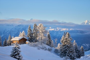 Snowy alpine cabin in the Swiss Alps