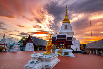 Phra Chaiyaphum Siri Maha Chedi (Arun Dhamma Sathan), which is located in Chaiyaphum, Thailand, is famous place in view under blue sky and sunset clouds. 