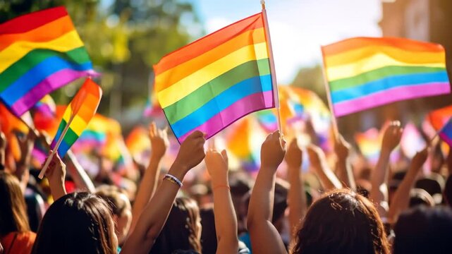 Pride parade with many rainbow flags
