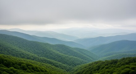 Landscape view of green mountains under a cloudy sky in daytime
