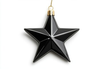 Black star ornament with glossy surface hanging by gold string. Holiday christmas tree decoration for elegant festive celebrations.