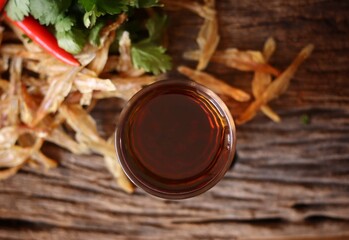 Fish sauce on wood background Thai food
