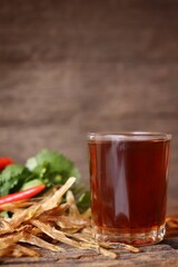 Fish sauce on wood background Thai food