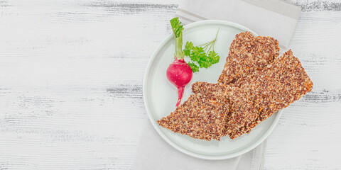 Flourless seed bread with radish and parsley. Vegan healthy eating concept, ready to eat food