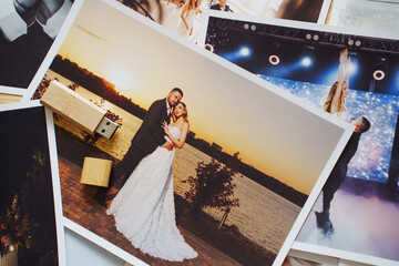 Wooden USB flash drive on printed wedding photos. 