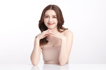 A beautiful young Asian woman with clean, fresh skin against a white background. Skincare, facial...