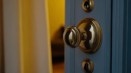 A close-up shot of a door handle on a door, suitable for use in real estate or property listings