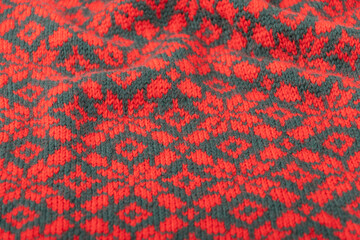 red knitted Christmas pattern  background, floral motif