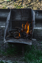 Open flame in a metal container used for heating or cooking in poor living conditions