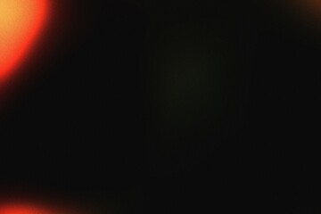Red and orange light leak with grain on a dark background. This striking overlay adds a vibrant, energetic touch to any project, evoking a sense of classic film or a futuristic glow