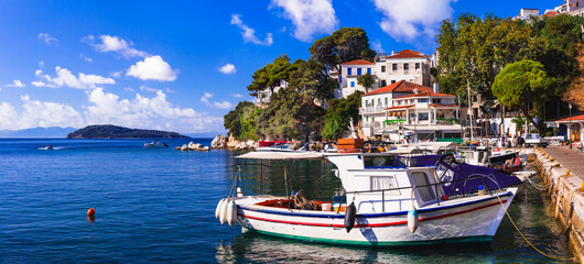 Greece, Sporades, beautiful Skiathos island, traditional fishing boats in charming old town in the morning light. greek vacation and tourism