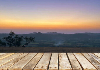 Wooden table top on blur mountain and grass field.Fresh and Relax concept.For montage product display or design key visual layout.View of copy space.