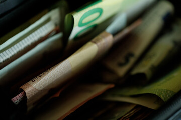 High-quality stock photo of euro banknotes inside a wallet. Perfect for finance, business, and...
