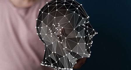 Abstract image of a person holding a 3D polygonal head, representing AI, technology, and data.