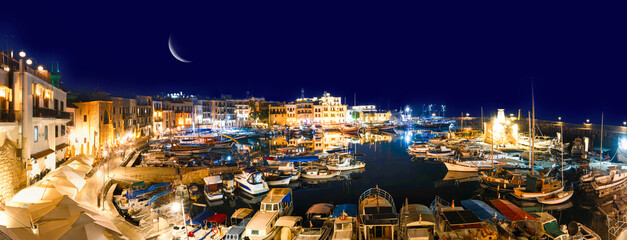 Kyrenia (Girne), Cyprus- July 1, 2025: Blue hour view in Kyrenia harbor which is currently a famous...
