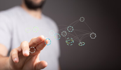 Image of a person interacting with a digital network visualization, perfect for technology and connectivity concepts.