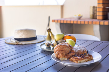 Breakfast setup on shaded terrace