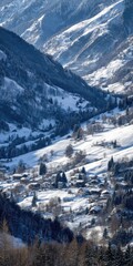 Snowy mountain valley with village nestled in the slopes