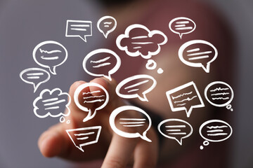 Hand interacting with digital speech bubbles,communication, networking, ideas.