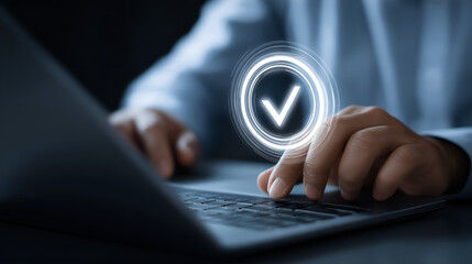 Digital Validation: Capturing a close-up image of hands interacting with a modern laptop, with a vibrant digital validation symbol hovering above.