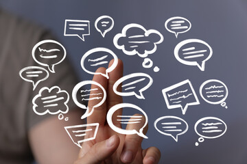 Hand interacting with digital speech bubbles. Communication, ideas, networking concept.