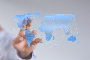 High-quality stock photo of a hand interacting with a digital world map showcasing global network...