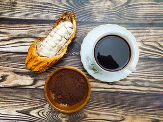 A cup of warm chocolate drink made from cocoa beans or Theobroma cacao that have been roasted,...