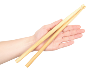 A hand holding a pair of wooden chopsticks, showcasing their smooth texture and natural color.