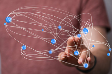 Abstract image of a hand interacting with a digital network. Ideal for technology, connection, and...