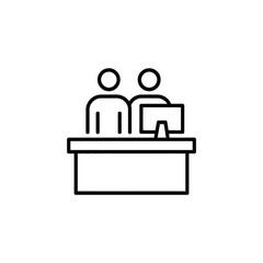 Two people working at a desk with a computer