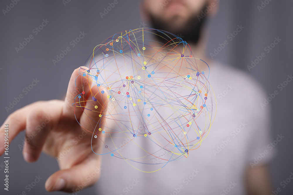 Poster stock photo of a person interacting with a digital network visualization, representing connection an