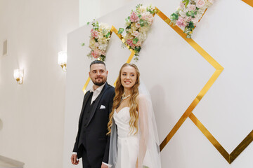 The bride and groom at the ceremony in the Wedding Palace. 