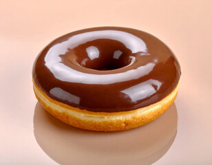 A single chocolate donut with a glossy, thick glaze on a plain background. 