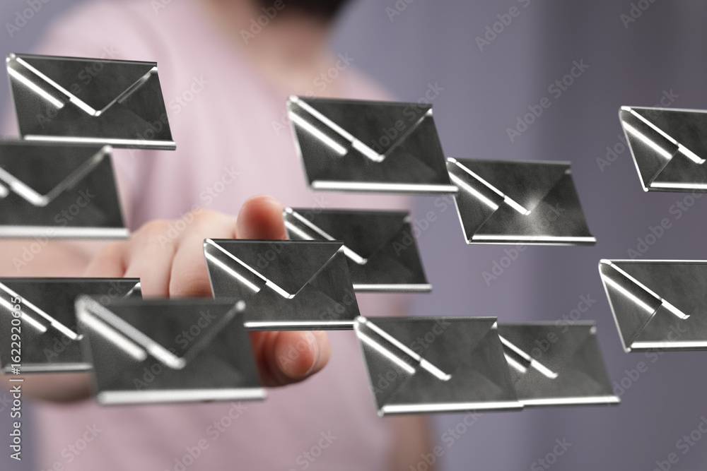 Aufkleber a hand interacts with numerous email icons, symbolizing digital communication and inbox management.