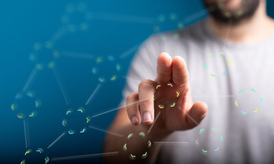 Close-up of a man's hand interacting with a digital network interface, showcasing connectivity and...