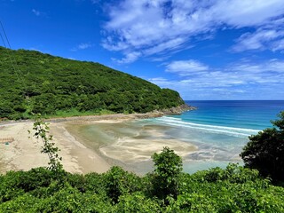 Japan, Nagasaki Prefecture, Kamigoto Islands, Nakadōri Island scenic coastline with clear turquoise sea and floating fish farms